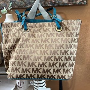 Color is tan with monogram body. Slightly used. Original.